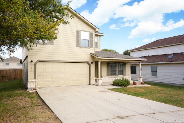 view of front property with a garage and a front lawn