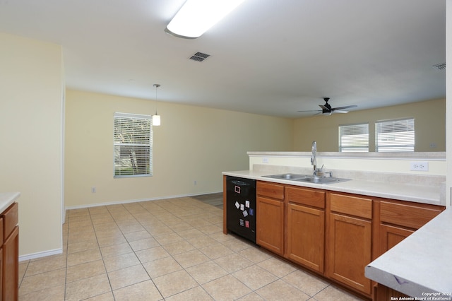 kitchen with ceiling fan, hanging light fixtures, sink, and a healthy amount of sunlight