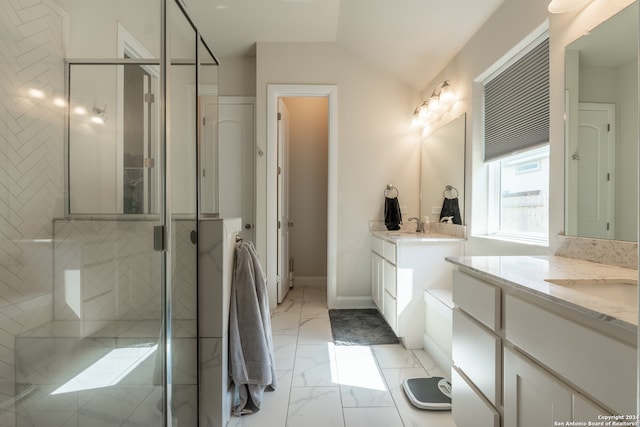 bathroom featuring vanity, a shower with shower door, and vaulted ceiling