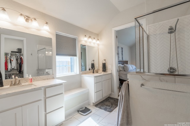 bathroom featuring vanity, lofted ceiling, and a shower with shower door