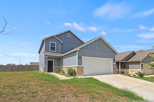 craftsman-style home featuring a front lawn and a garage