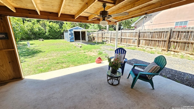 view of patio / terrace featuring a storage shed and ceiling fan