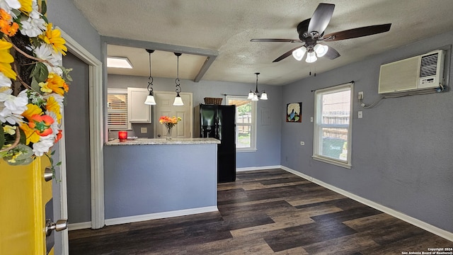 kitchen with ceiling fan, dark wood-type flooring, black fridge with ice dispenser, white cabinetry, and an AC wall unit