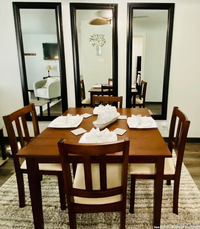 dining area with hardwood / wood-style flooring