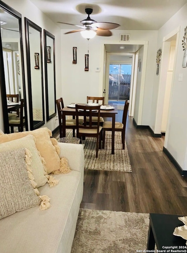 dining room featuring ceiling fan and dark hardwood / wood-style flooring