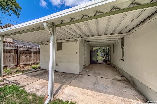 view of parking / parking lot with a carport