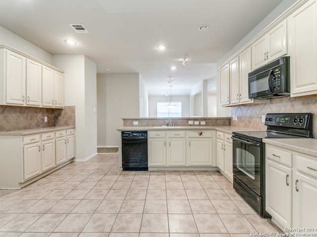 kitchen with light tile patterned floors, sink, kitchen peninsula, black appliances, and decorative backsplash