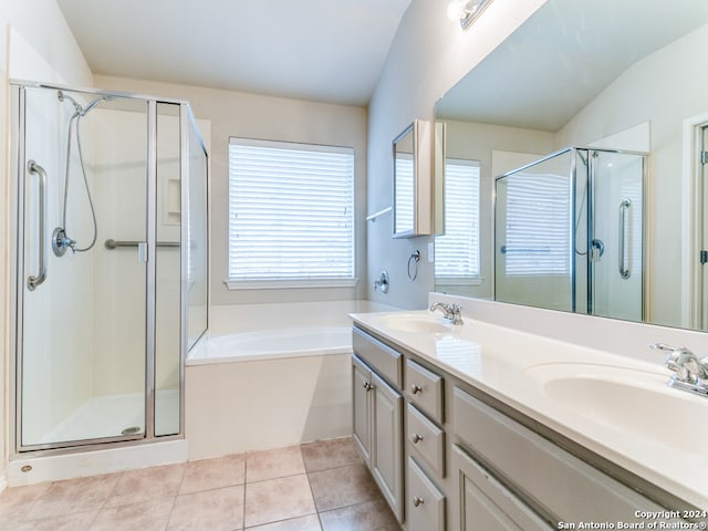 bathroom featuring independent shower and bath, tile patterned flooring, vanity, and plenty of natural light