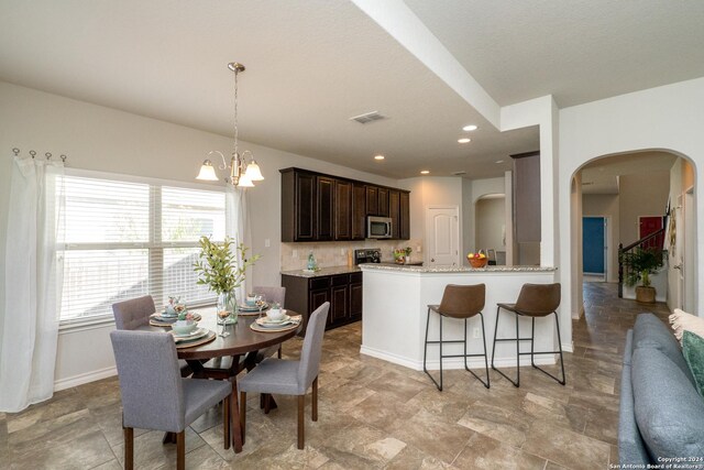 dining room with a chandelier