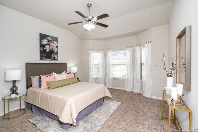 carpeted bedroom featuring vaulted ceiling and ceiling fan