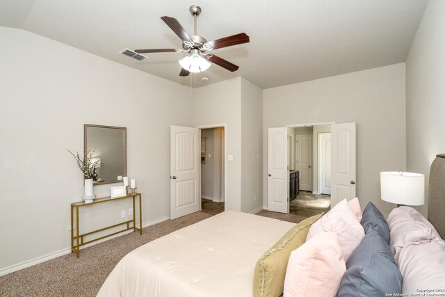 bedroom with carpet floors, lofted ceiling, and ceiling fan