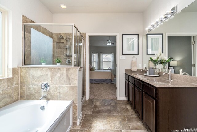 bathroom featuring shower with separate bathtub, vanity, and ceiling fan