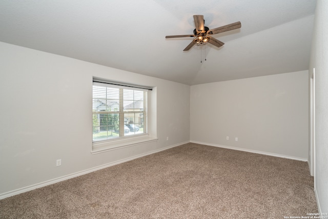 unfurnished room featuring vaulted ceiling, ceiling fan, and carpet floors