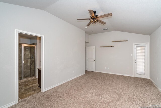 carpeted empty room featuring lofted ceiling and ceiling fan