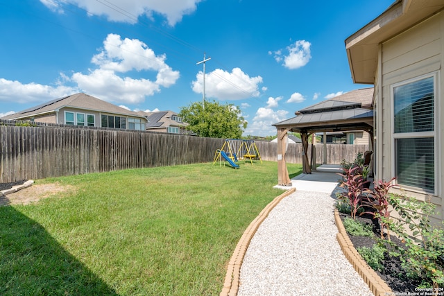 view of yard with a playground and a gazebo