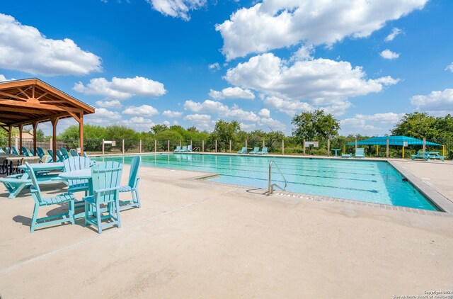 view of pool featuring a patio area