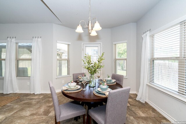 dining space featuring an inviting chandelier