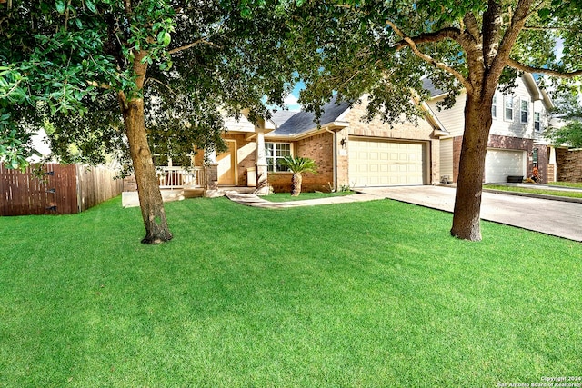 view of front facade featuring a garage and a front lawn