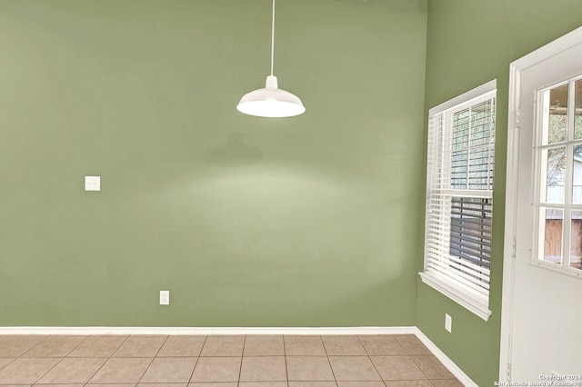 unfurnished dining area with light tile patterned floors