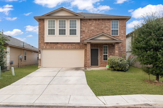 traditional-style home featuring a front yard, concrete driveway, and brick siding