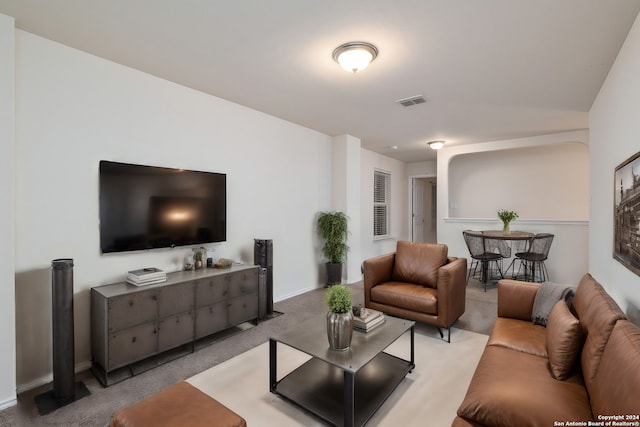 living room with visible vents and light colored carpet