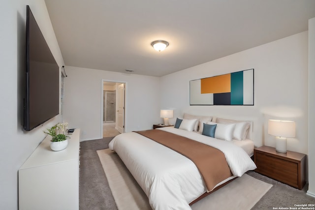 bedroom featuring carpet, connected bathroom, and visible vents