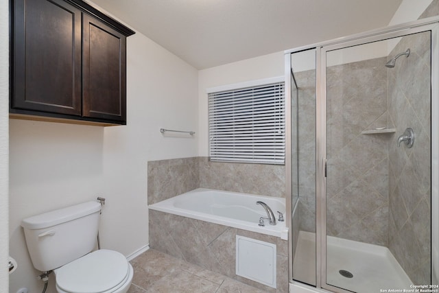 bathroom featuring tile patterned floors, a shower stall, toilet, and a bath