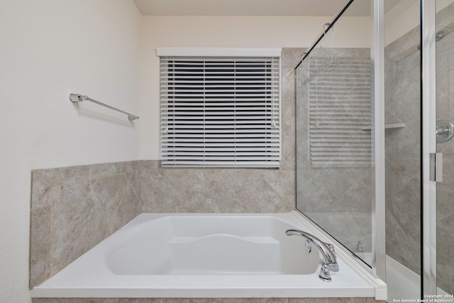 bathroom with a garden tub