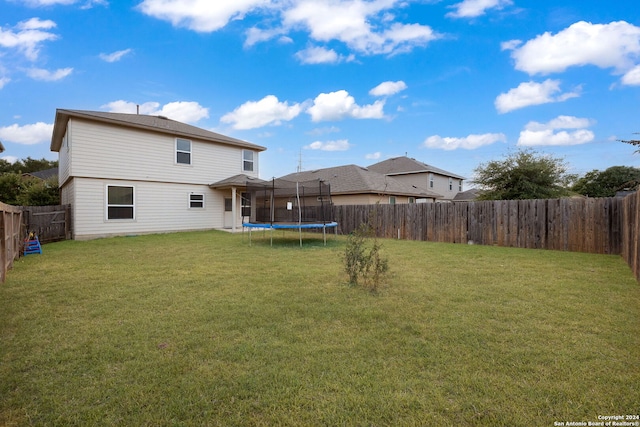 exterior space featuring a fenced backyard and a lawn