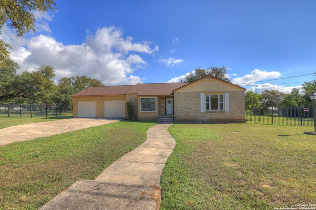 view of front facade featuring a front yard and a garage