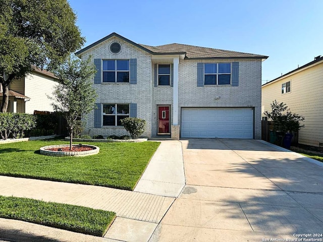 view of front facade with a garage and a front lawn