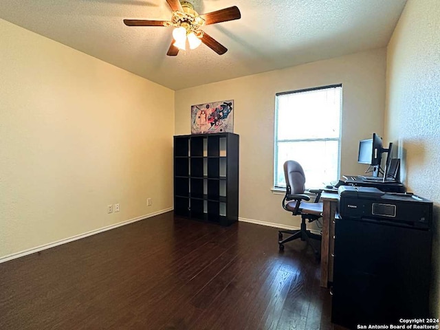 office area with ceiling fan, dark hardwood / wood-style floors, and a textured ceiling