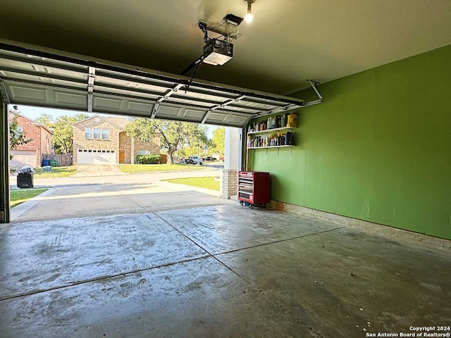 garage with a garage door opener and a carport