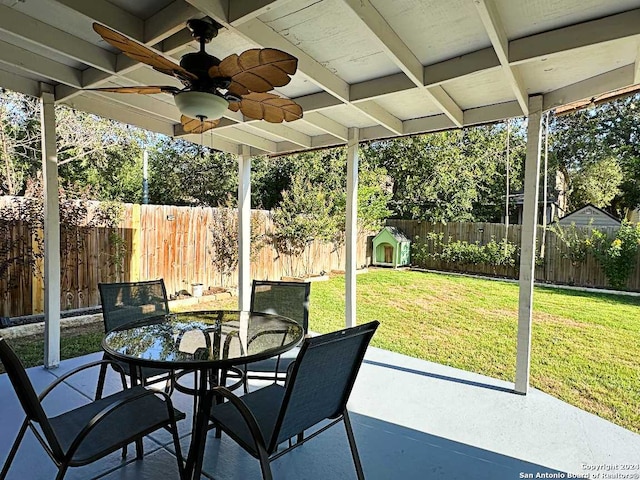 exterior space with ceiling fan