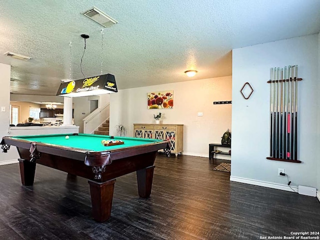 rec room with a textured ceiling, billiards, and dark hardwood / wood-style flooring