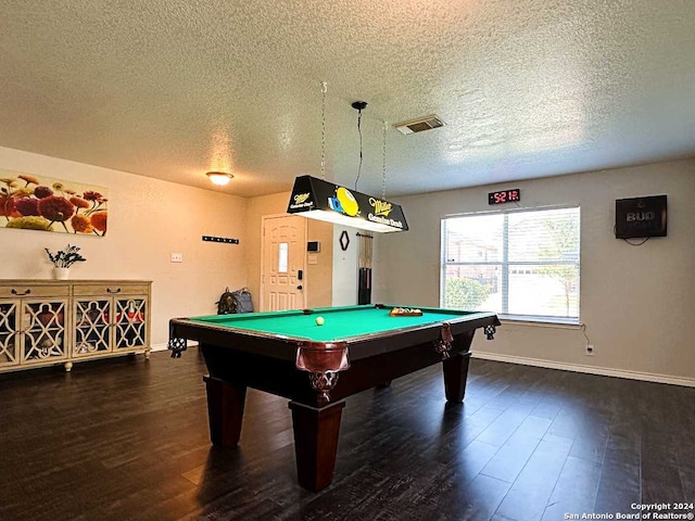 game room featuring pool table, a textured ceiling, and dark hardwood / wood-style floors