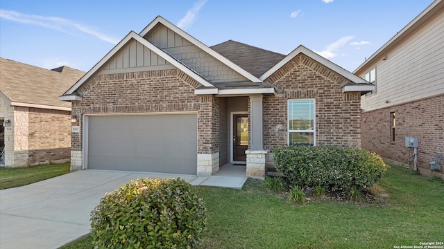 craftsman inspired home with a garage and a front yard