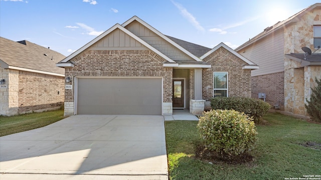 view of front of home with a garage and a front yard