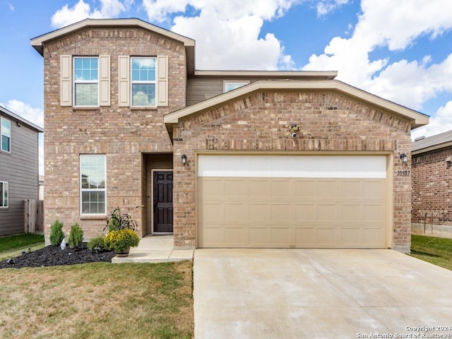 traditional-style home featuring a garage, concrete driveway, and brick siding