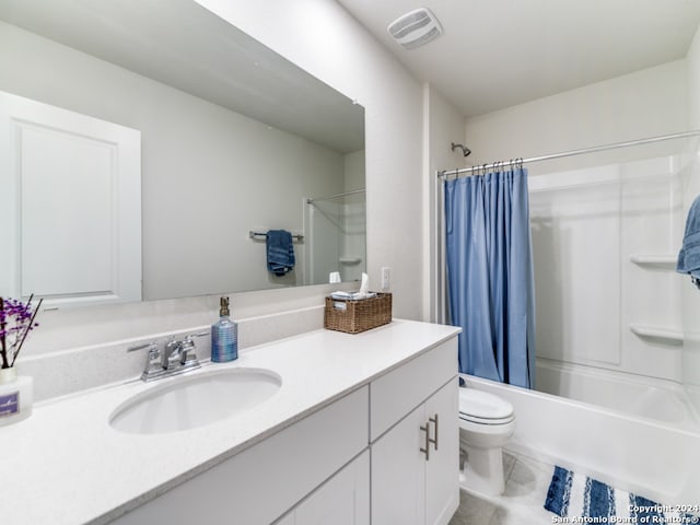 full bathroom with shower / tub combo, vanity, and toilet