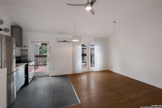 kitchen featuring stainless steel refrigerator, white electric range oven, ceiling fan, dark hardwood / wood-style floors, and wall chimney range hood