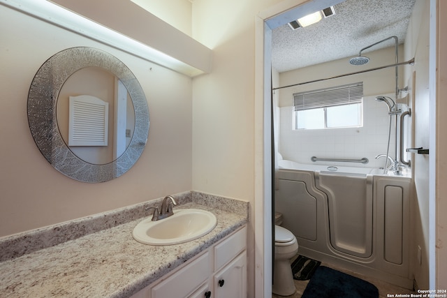 bathroom with a tub to relax in, a textured ceiling, vanity, and toilet