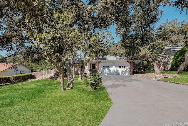 view of front of house with a garage and a front yard