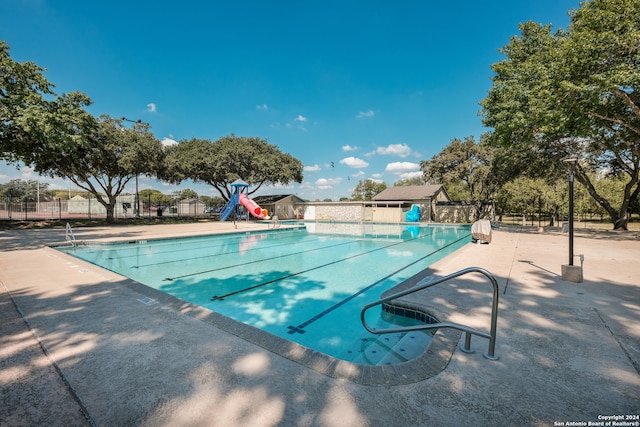 view of pool featuring a patio area