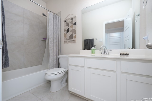 full bathroom featuring shower / tub combo with curtain, vanity, toilet, and tile patterned floors