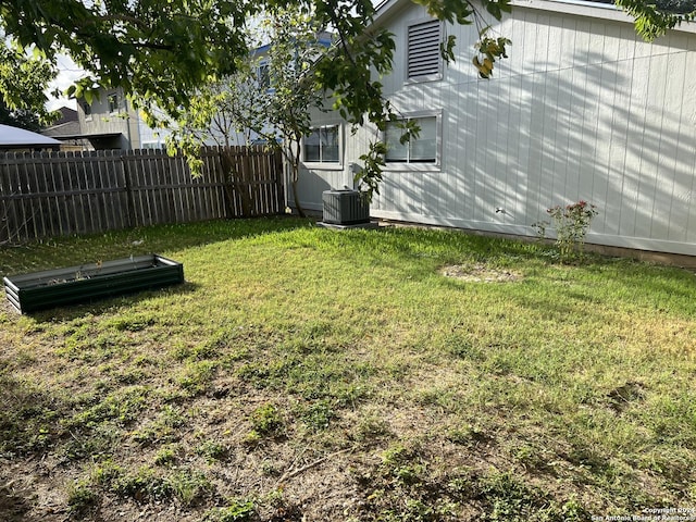 view of yard with central air condition unit