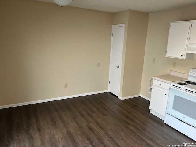 kitchen featuring white electric range oven, white cabinetry, a textured ceiling, and dark hardwood / wood-style flooring