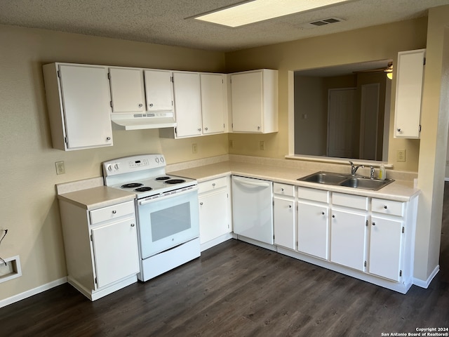 kitchen featuring sink, white appliances, white cabinetry, and a textured ceiling