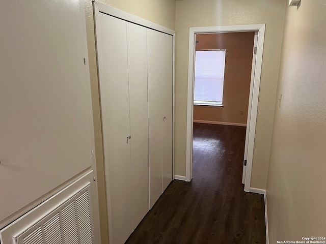 hallway with dark wood-type flooring