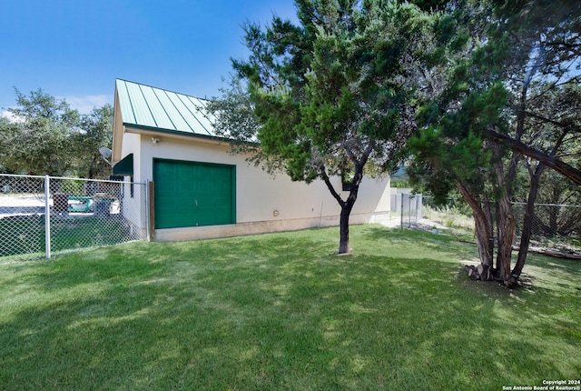 view of yard with a garage